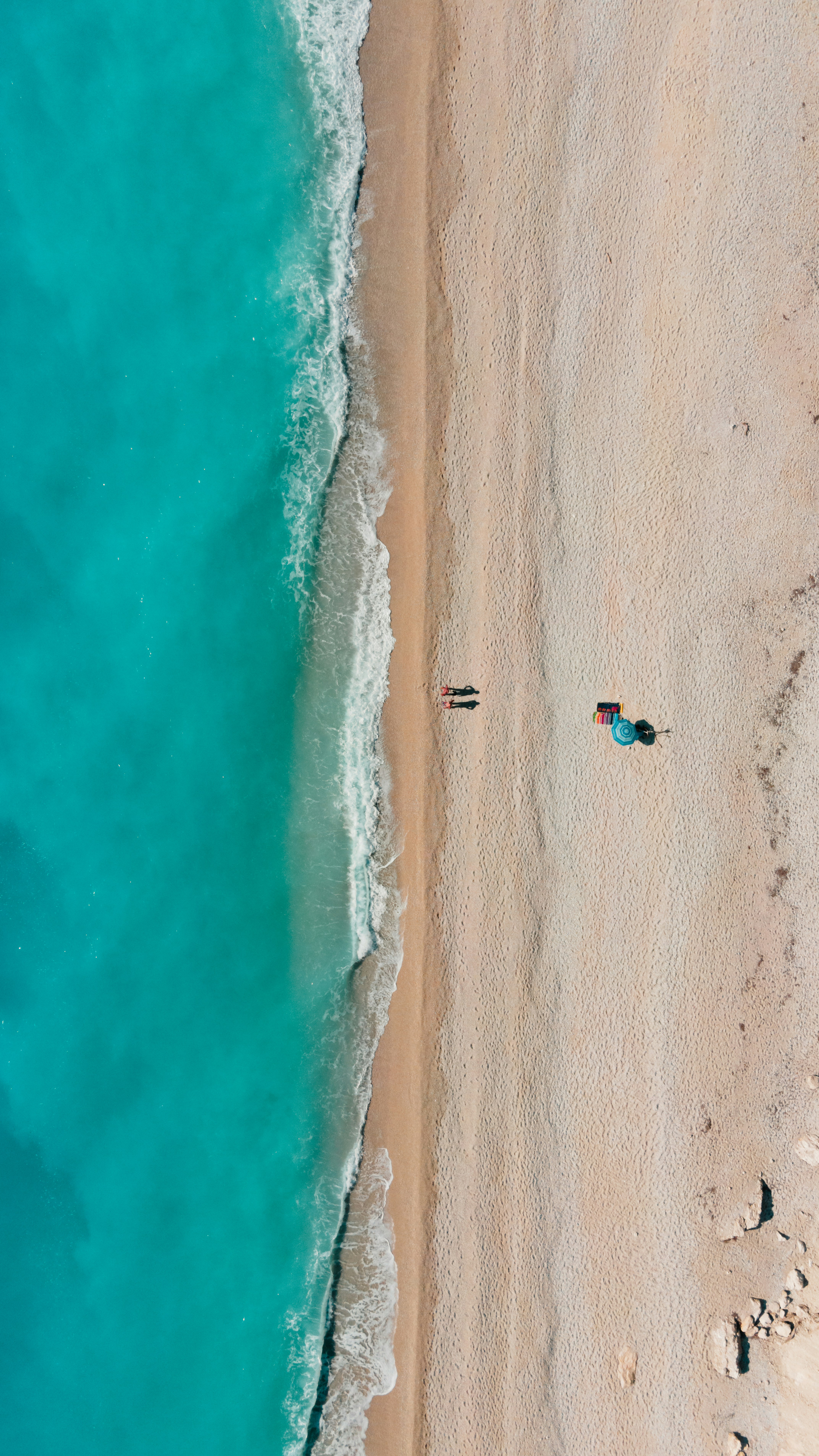 Windsurfers on the sparkling sea at Vassiliki, Lefkada's wind sports capital